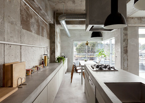 Bare-concrete-apartment-by-Airhouse-Design-Office-presents-its-own-fashion-exhibitions_dezeen_1