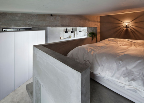Bare-concrete-apartment-by-Airhouse-Design-Office-presents-its-own-fashion-exhibitions_dezeen_11