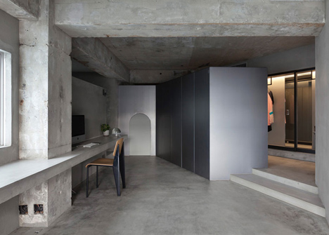 Bare-concrete-apartment-by-Airhouse-Design-Office-presents-its-own-fashion-exhibitions_dezeen_13