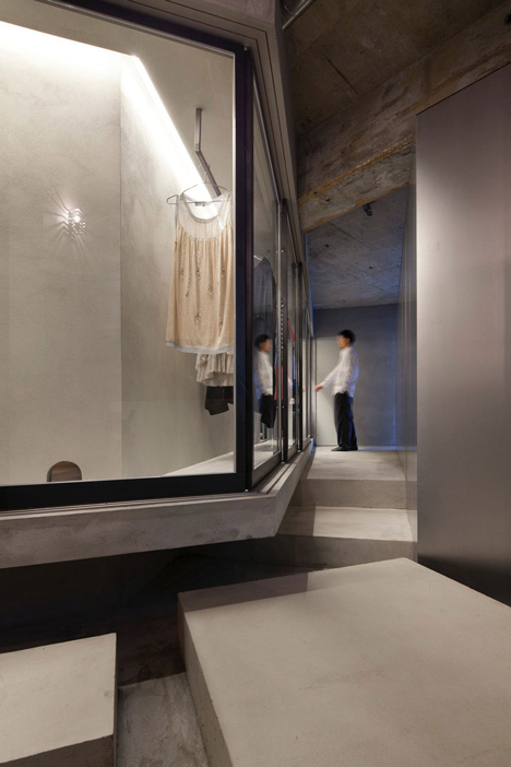 Bare-concrete-apartment-by-Airhouse-Design-Office-presents-its-own-fashion-exhibitions_dezeen_16