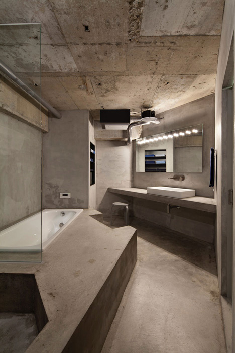 Bare-concrete-apartment-by-Airhouse-Design-Office-presents-its-own-fashion-exhibitions_dezeen_17