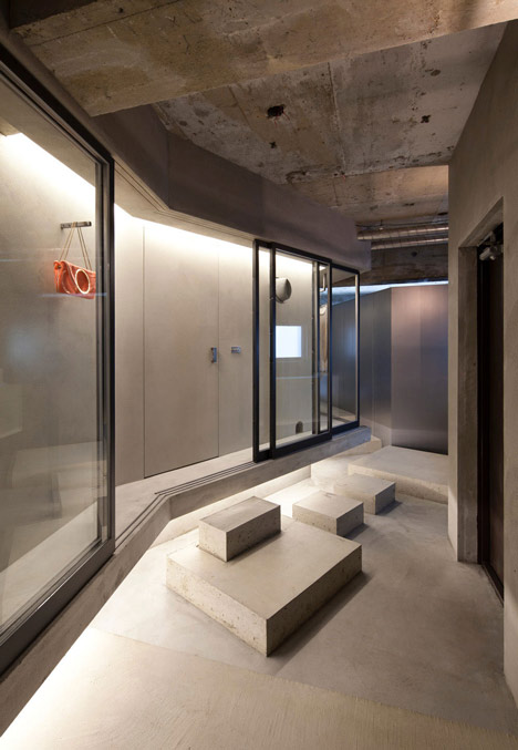 Bare-concrete-apartment-by-Airhouse-Design-Office-presents-its-own-fashion-exhibitions_dezeen_4