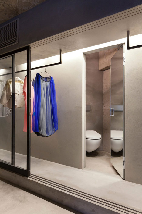 Bare-concrete-apartment-by-Airhouse-Design-Office-presents-its-own-fashion-exhibitions_dezeen_8